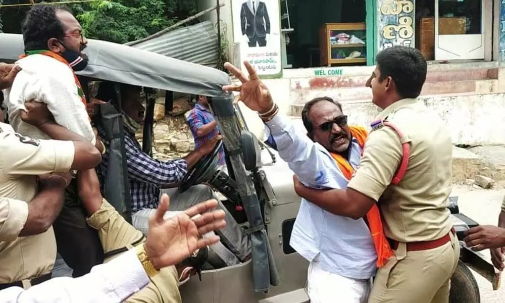 Police arresting the leaders of BJP, VHP, RSS and Jana Sena and shifting to police station at Pathikonda on Thursday