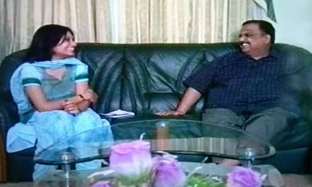 The interviewer sharing a lighter moment with SP Balasubrahmanyam