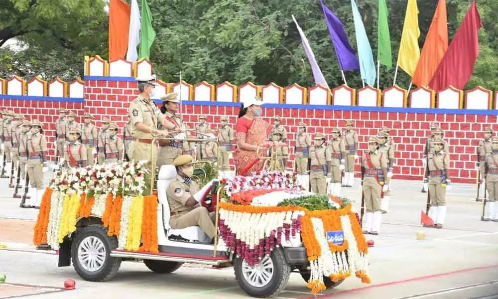Home Minister Mekathoti Sucharita along with DGP D Gautam Sawang receives guard of honor during passing out parade of probationary Sub-Inspectors at PTC in Anantapur on Friday