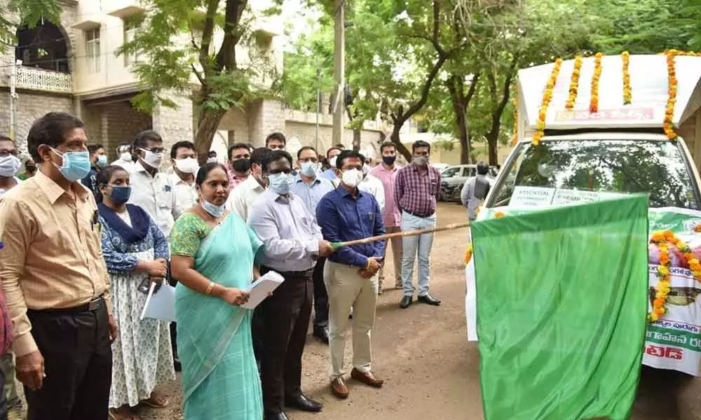 Collector I Samuel Anand Kumar flagging off mobile campaign vehicle in Guntur on Friday.