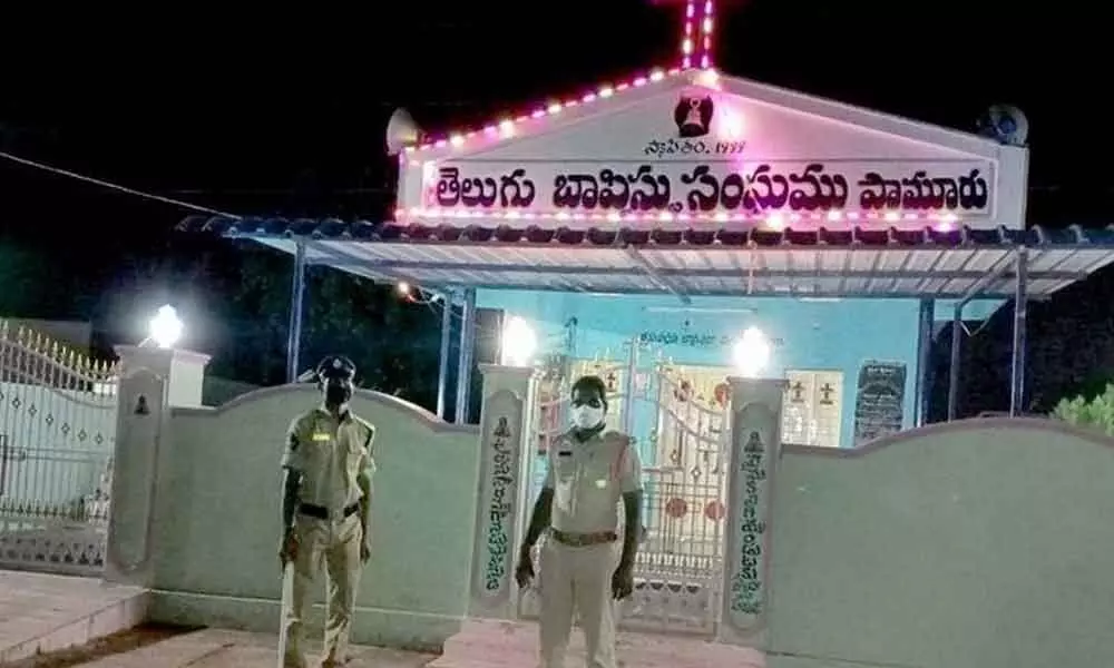 Police personnel guarding the Telugu Baptist Sangham Church at Pamur in Prakasam district