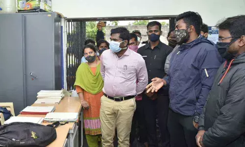 Collector Gandham Chandrudu inspecting village secretariat at Gottukur in Kuderu mandal on Saturday