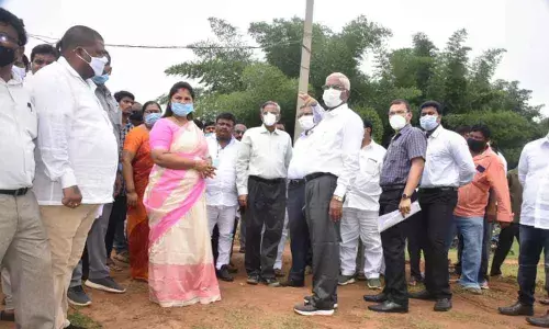 Deputy Chief Minister P Pushpasreevani and Special Chief Secretary Satish Chandra at the site identified for tribal varsity in Vizianagaram
