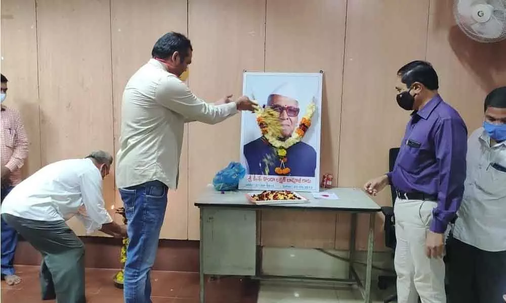 Khammam District Collector RV Karnan offering floral tributes to Konda Laxman’s portrait at his office in Khammam on Sunday