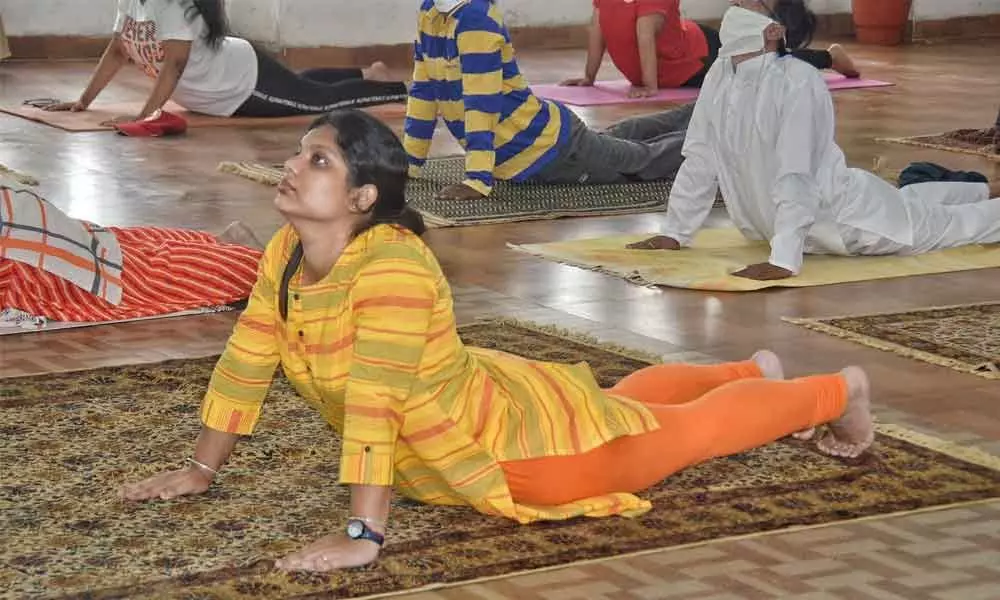 Municipal Commissioner Pamela Satpathy practising yoga in Warangal on Sunday