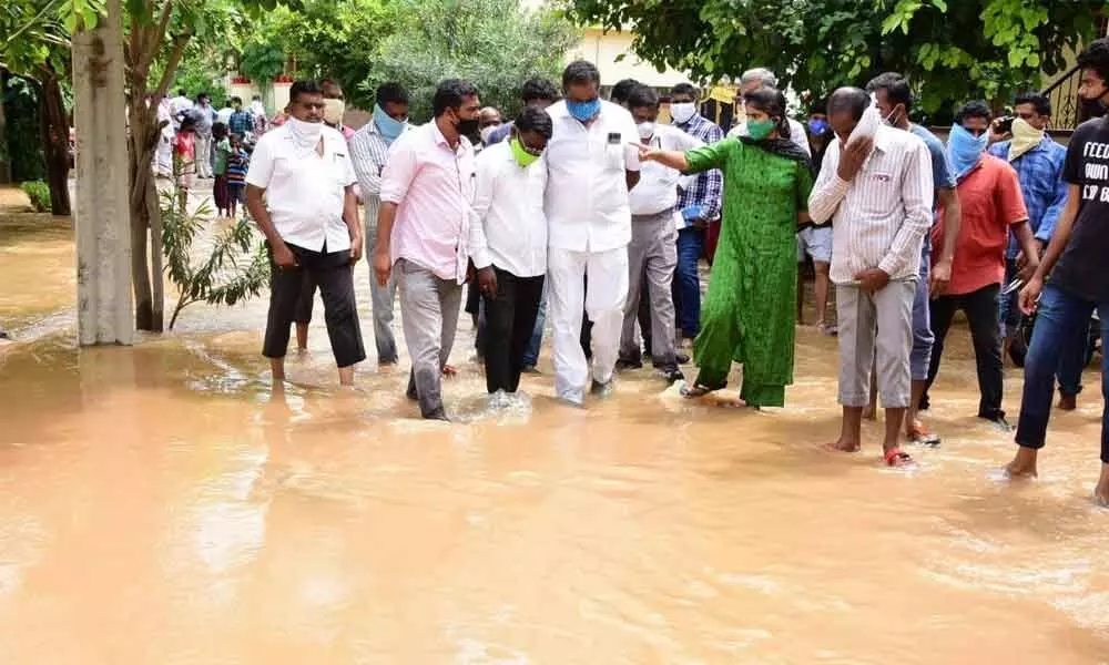 City Mayor Y Sunil Rao and Municipal Commissioner V Kranthi visiting flood affected areas in Bhagath Nagar in Karimnagar city on Sunday