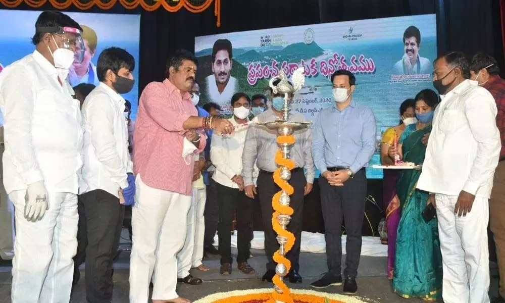 Tourism Minister M Srinivasa Rao and Managing Director of Andhra Pradesh Tourism Development Corporation Pravin Kumar among others inaugurating the World Tourism Day celebrations hosted in Visakhapatnam on Sunday.