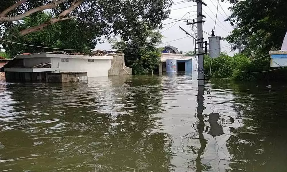 Houses submerged in floodwater at Ramapuram village in Dachepalli mandal in Guntur district on Sunday