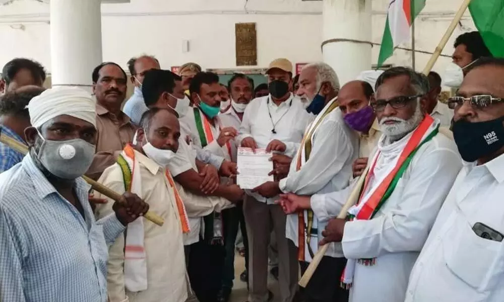 Congress leaders giving representation to Bodhan RDO demanding the cancellation of LRS scheme, here, on Monday