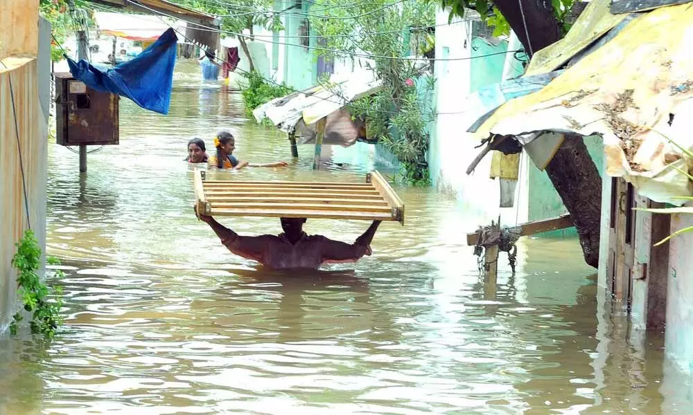 Flood victims taking shelter at IGMC stadium Photos: Y Vinay Kumar