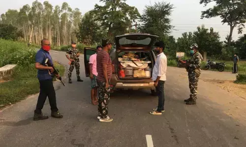 Police personnel checking a vehicle in  Jayashankar-Bhupalpally district on Monday