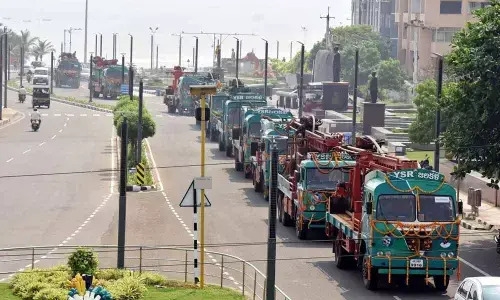 Borewell drilling trucks proceed ahead as Minister M Srinivasa Rao launches YSR Jala Kala in Visakhapatnam on Monday  	Photo: A Pydiraju