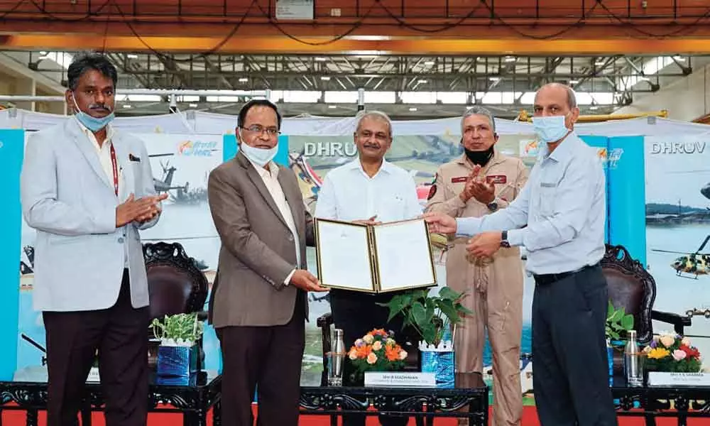 The Roll-out certificate of 300th helicopter being handed over to G V S Bhaskar, CEO, Helicopter Complex by Y K Sharma, additional director general (South Zone), directorate general of Aeronautical Quality Assurance at a programme held at HALs Helicopter Division on Tuesday.