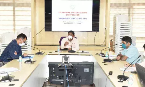 State Election Commissioner C Parthasarathi holding a meeting with the Health Secretary and GHMC Commissoner on conduct of GHMC polls, in Hyderabad on Thursday