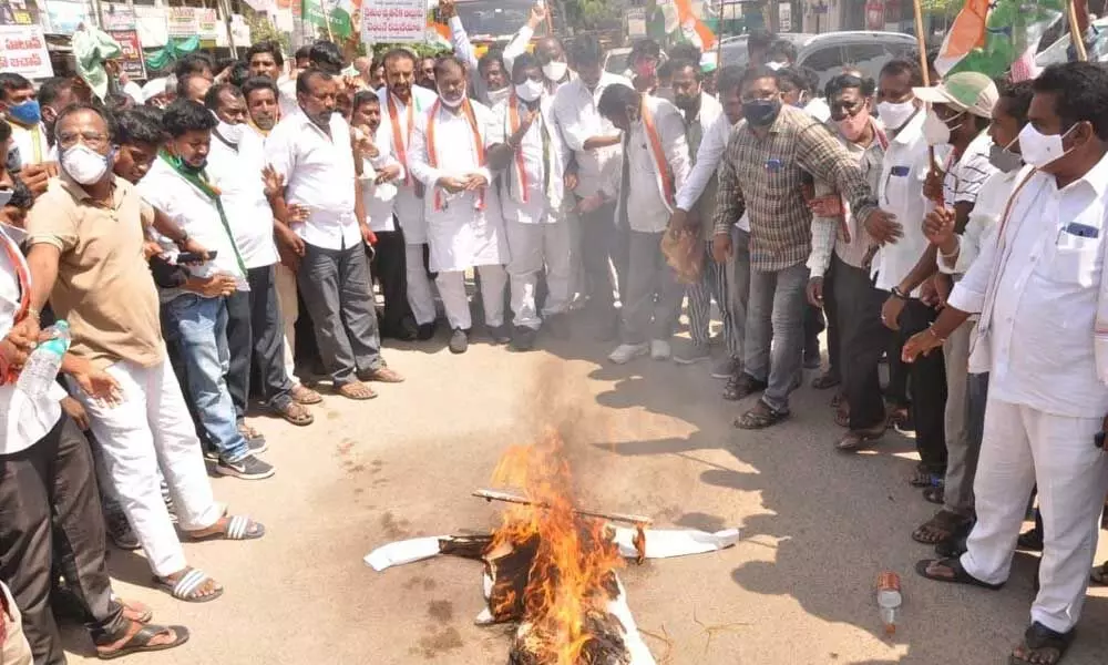 Congress workers staging protest against the UP government in Kamareddy on Friday