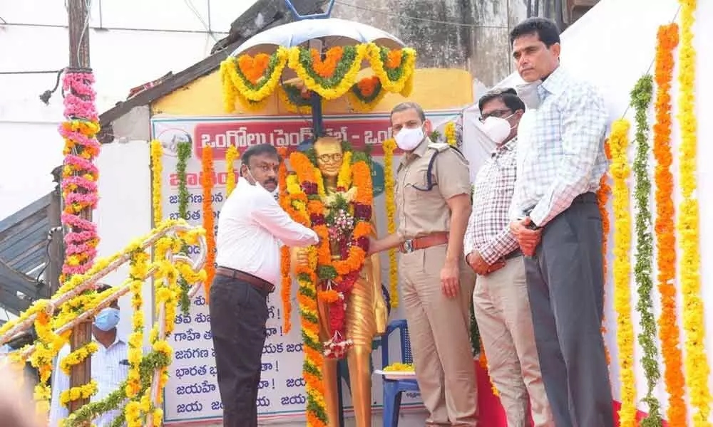 Prakasam District Collector Dr Pola Bhaskara, SP Siddharth Kaushal and others paying tributes to Mahatma Gandhi in Ongole on Friday
