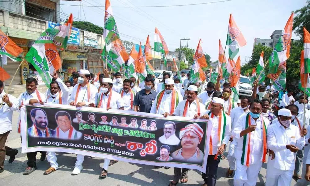 Congress workers and leaders taking out a rally against the Centre’s agri Bills in Nalgonda town on Friday