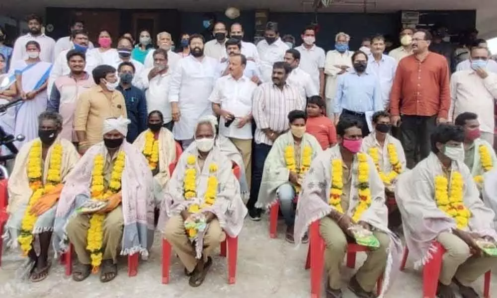Rajanagaram MLA Jakkampudi Raja seen with YSRCP activists at Sriramapuram after paying tributes to Mahatma Gandhi on Friday
