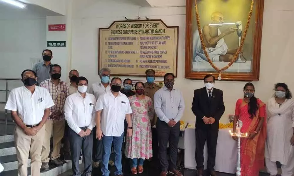 Development Commissioner A Rama Mohan Reddy and other officials paying tributes to the Mahatma on the occasion of his birth anniversary at VSEZ  in Visakhapatnam on Friday