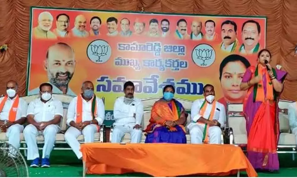 BJP State Mahila Morcha President Geeta Murthy speaking at BJP district workers’ meeting, in Kamareddy, on Saturday