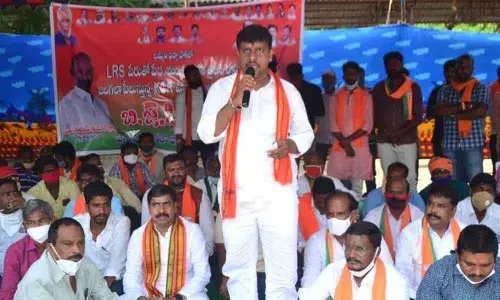 BJP District Party President Galla Satyanarayana speaking at the protest programme on Saturday in Khammam