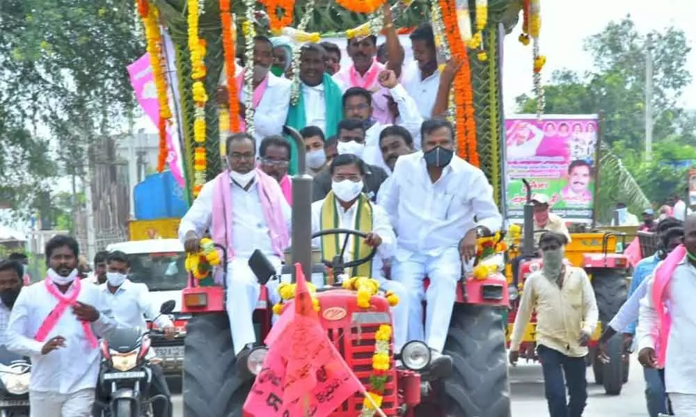 Agriculture Minister Sinigireddy Niranjan Reddy participating in a tractor rally in Wanaparthy on Sunday