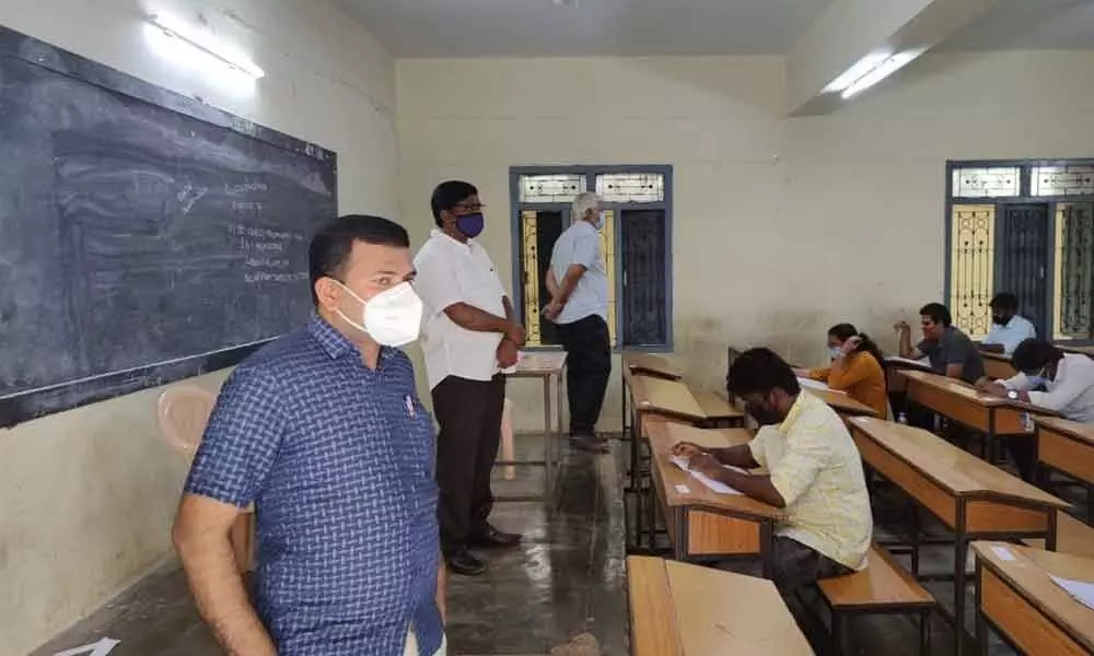 Joint Collector V Veerabrahmam inspecting candidates writing the examination in Tirupati on Sunday