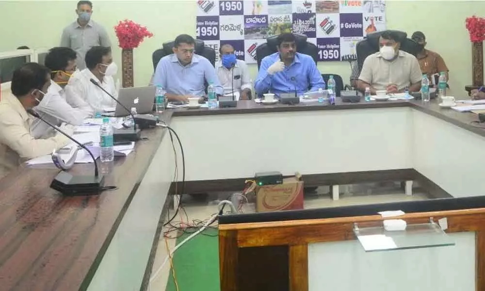 District Collector J Nivas conducting a review meeting with officials on Covid situation, in Srikakulam on Sunday