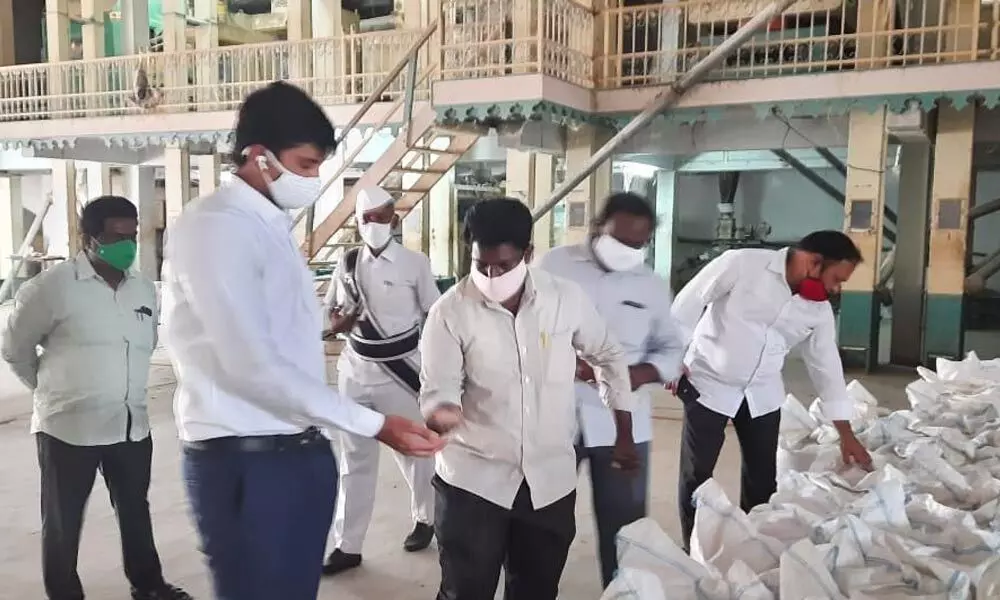 Vijayawada Sub-Collector HM Dhyana Chandra inspecting a rice mill