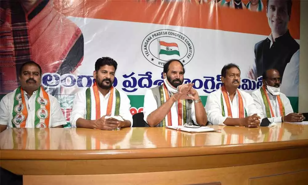 TPCC president N Uttam Kumar Reddy along with Revanth Reddy, MP and Mohd Shabbir Ali addressing the media at Gandhi Bhavan on Monday.