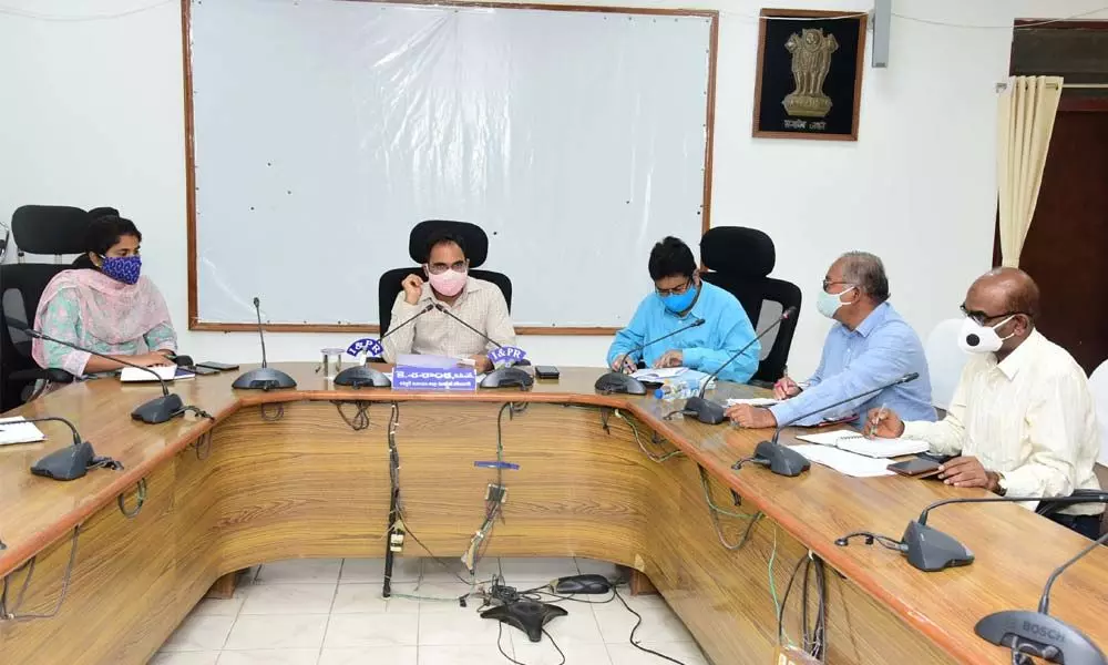 District Collector K Shashanka at a review meeting with officials of various departments at the Collectorate conference hall in Karimnagar on Monday