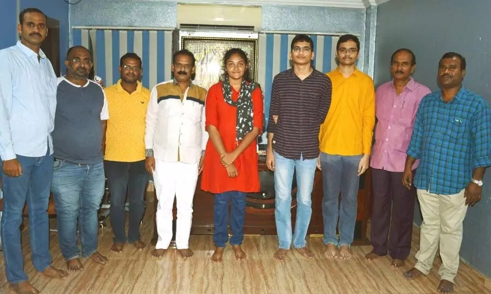 Krishnaveni Junior College Directors along with the students, who scored good ranks in IIT and JEE Advanced, in Khammam on Monday
