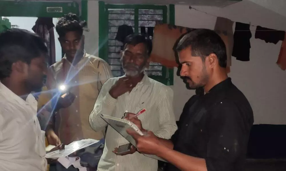 Hanwada mandal MPDO officials conducting assets survey during night in Vepoor village on Monday night