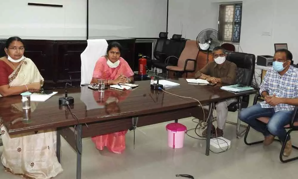 GMC Commissioner Challa Anuradha addressing a meeting held at GMC office in Guntur on Tuesday