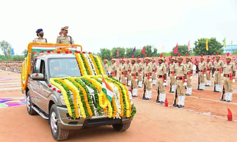 CTC Principal and ACP S Srinivas receiving police honour during the passing out parade programme at Karimnagar