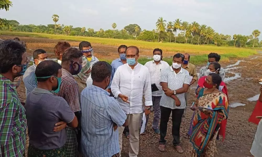 Agriculture Special Commissioner H Arun Kumar interacting with farmers at Uppulasatram village in East Godavari district on Wednesday