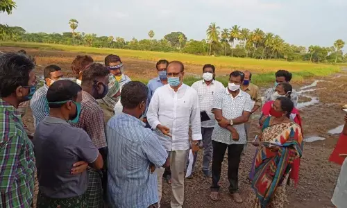 Agriculture Special Commissioner H Arun Kumar interacting with farmers at Uppulasatram village in East Godavari district on Wednesday