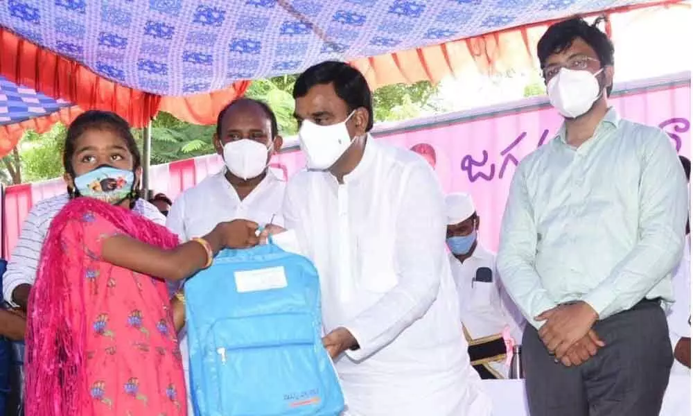 Deputy Chief Minister Amzath Basha distributing Jagananna Vidya kanuka kits to students at ZP girls school in Kadapa on Thursday