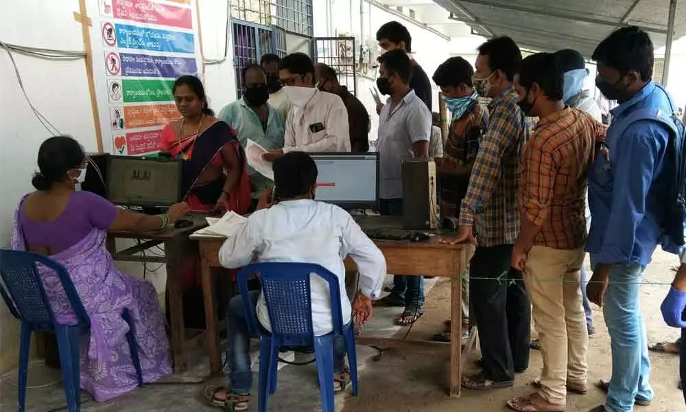 Customers wait for their turn at sub-registrar office in Srikakulam