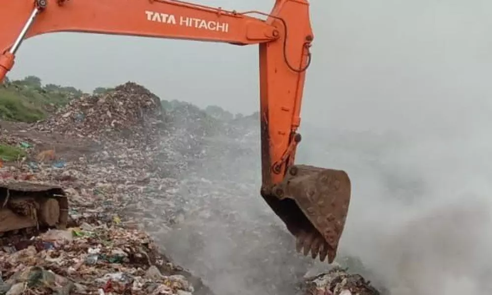 Spurious gutka packets being destroyed at Gargeyapuram dump yard in Kurnool on Friday