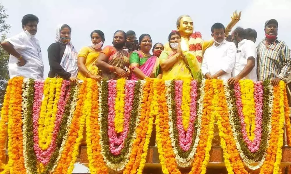 YSRCP state general secretary N Lakshmi Parvathi unveiling statue of NT Rama Rao in Musunuru on Friday