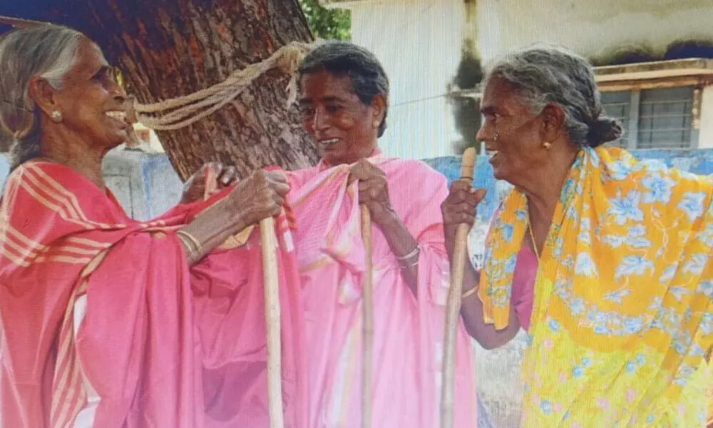 Elderly women seen after receiving Bathukamma sarees in Chivvemla mandal on Friday