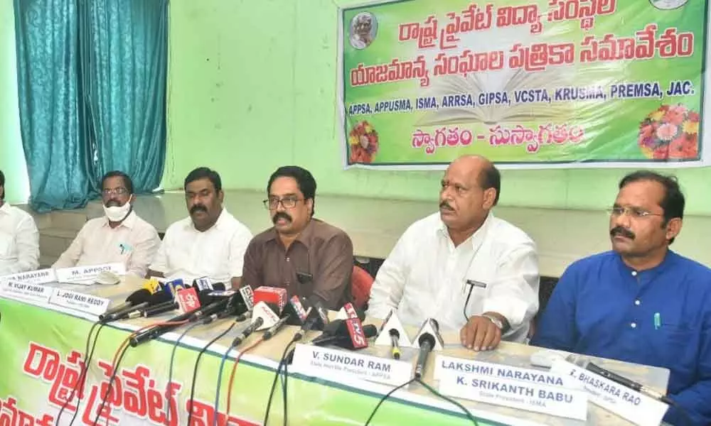 Members of Andhra Pradesh Private Unaided School Managements Association addressing the media in Vijayawada on Saturday