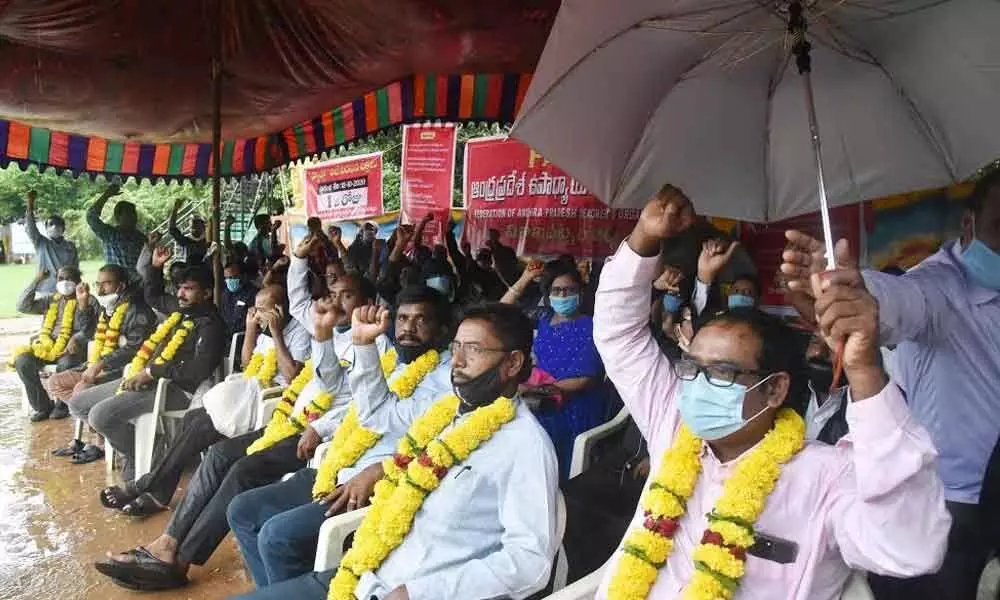 Federation of Andhra Pradesh Teachers Organisation members staging a protest against government’s decisions in Visakhapatnam on Monday