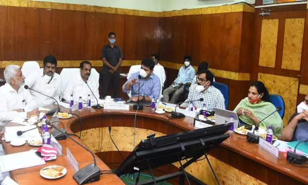 District in-Charge Minister Kurasala Kannababu conducting a review meeting with the officials over the preparedness of monsoon, in Visakhapatnam on Monday
