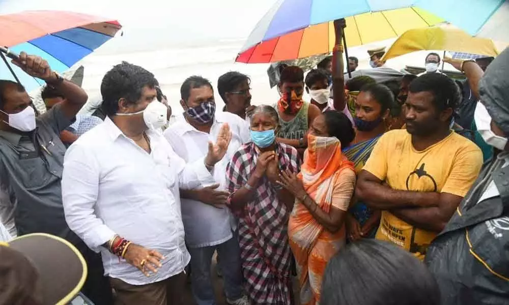 Tourism Minister Muttamsetti Srinivasa Rao interacting with the fishermen in Visakhapatnam on Monday