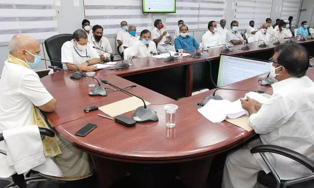 Additional EO A V Dharma Reddy conducting a meeting with donors of vegetable vendors at Annamaiah Bhavan in Tirumala on Monday