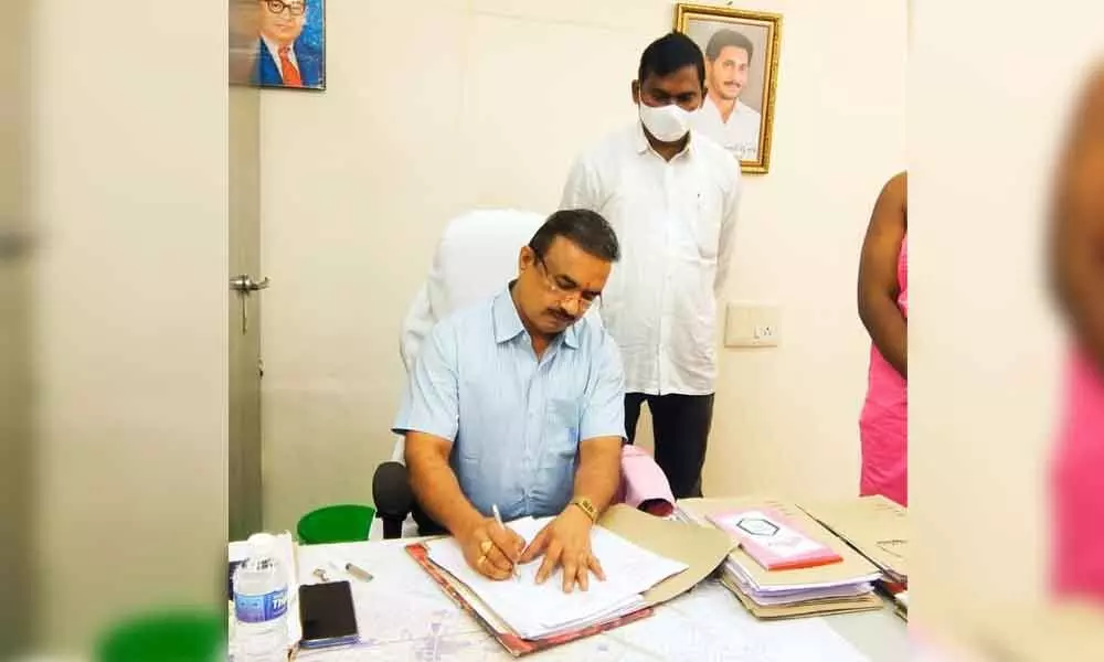 K Ramachandra Reddy taking charge as Municipal Commissioner in Narasaraopet on Monday