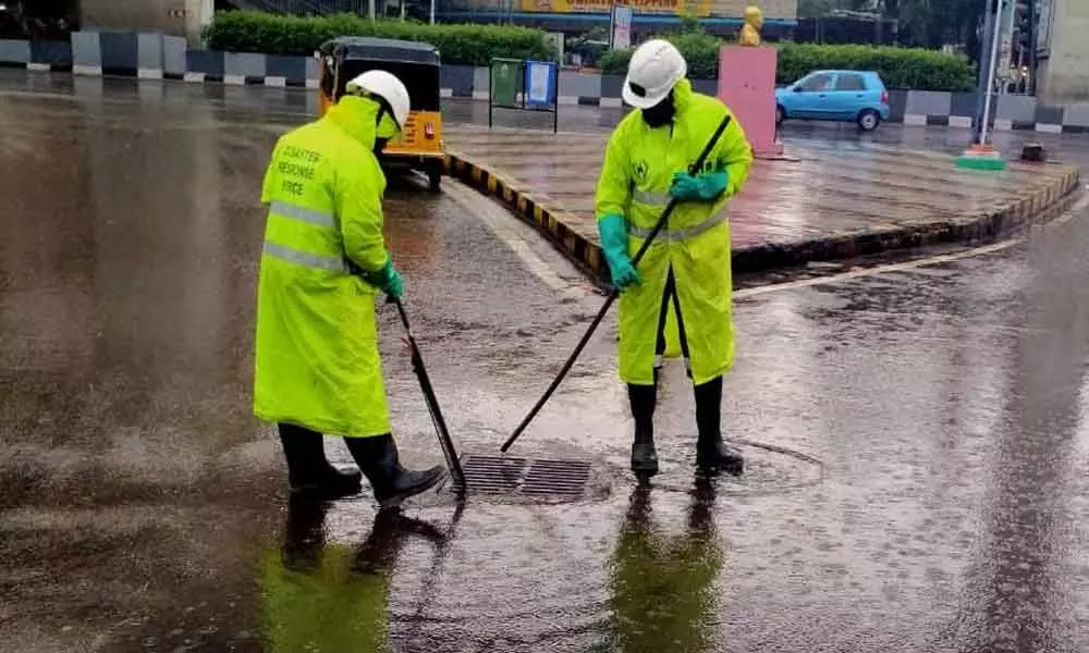 GHMC teams clearing  water on a war-footing