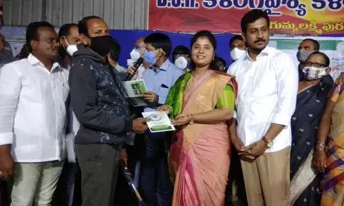 Distributing pattas to farmers